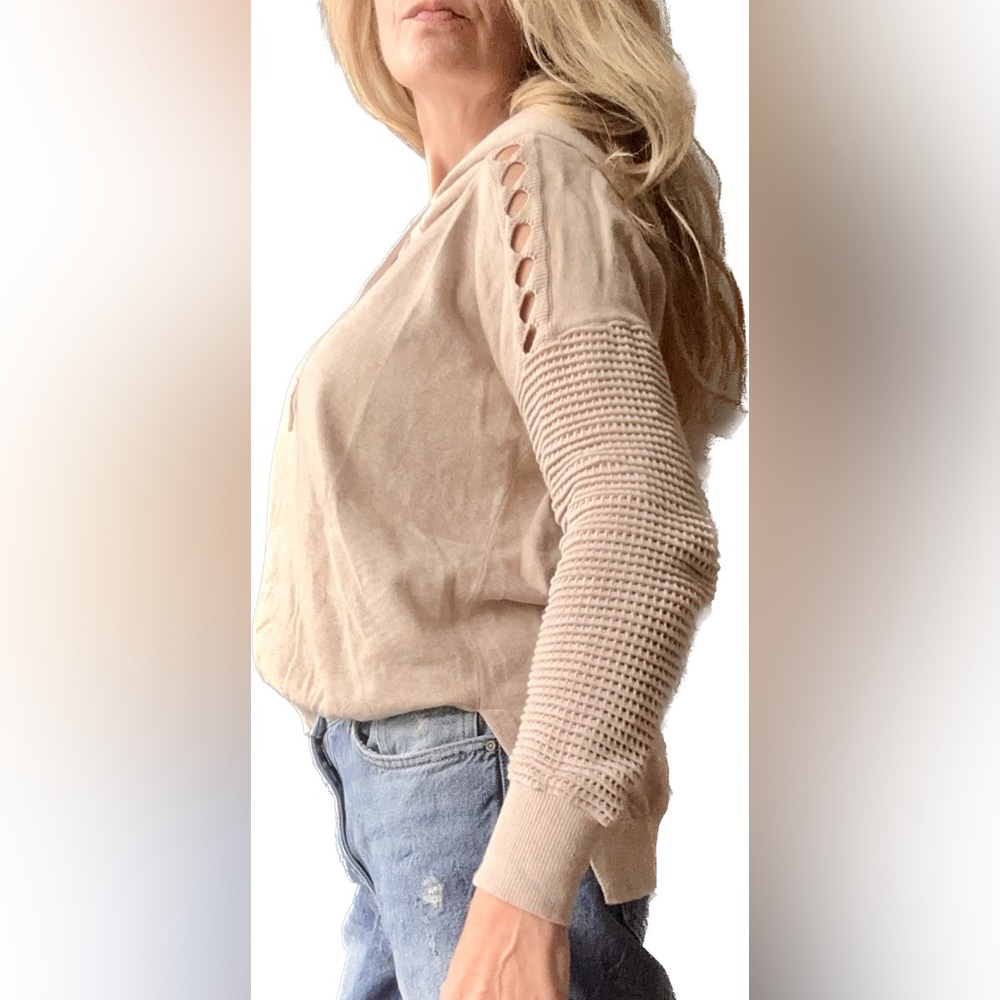 Fabulous neutral for all seasons. Fun peek-a-boo detailing along back & sleeves
